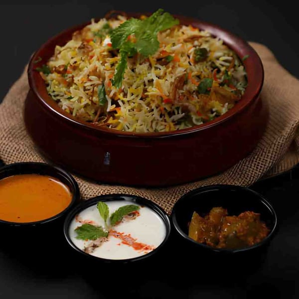 Biryani Pot Chandler's chicken biryani with mint, served with three side sauces.